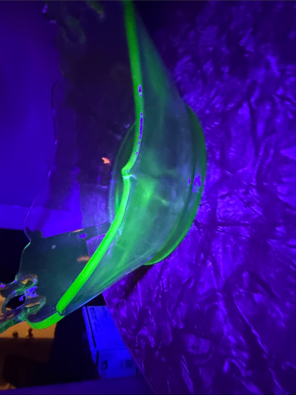 Vaseline glass bowl glows under uv light